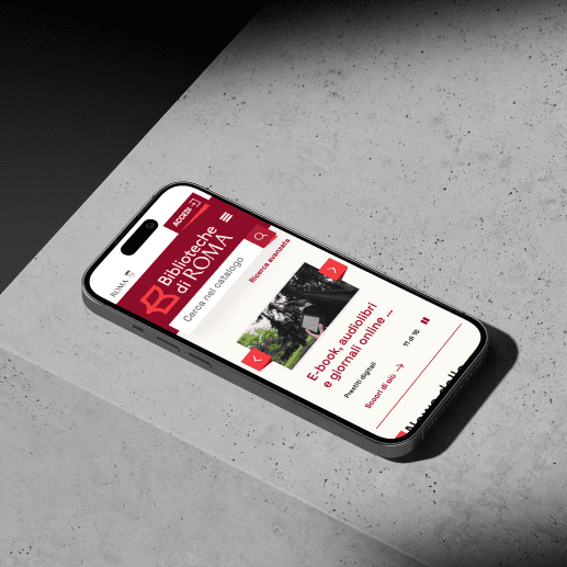 biblioroma-component Uno smartphone che visualizza il portale delle Biblioteche di Roma con un design intuitivo e moderno.